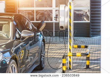 Refueling For Electric Cars E-mobility. Charging The Machine, Compartment Door Is Open, The Electric