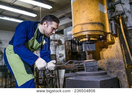 Brutal Man Forges Iron