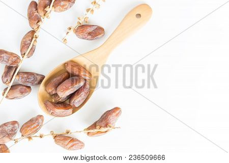Dates Fruit In Wooden Ladle On White Background,dried Date Palm Fruits Top View