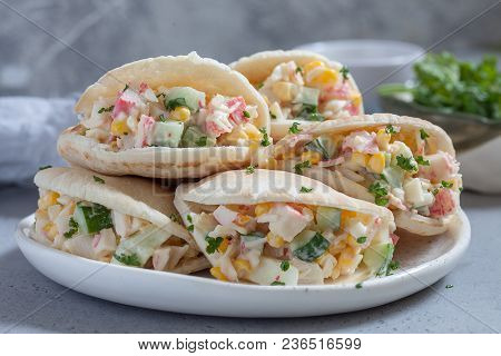 Stuffed Pita Bread With Crab Salad On Table.