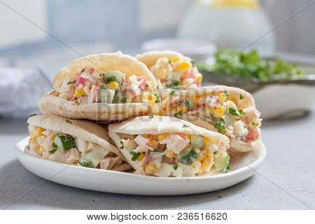 Stuffed Pita Bread With Crab Salad On Table.