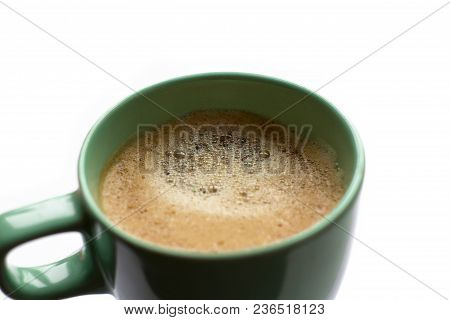 Close Up Green Mug Cup Of Black Coffee On A White Background