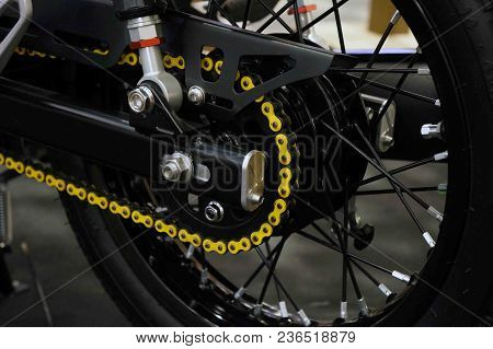 Color Detail On A Yellow Chain From A Motorcycle