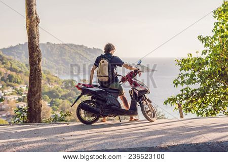 A Man On A Motorbike Against The Sea.