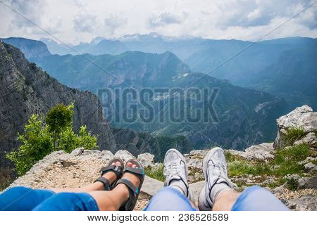 Loving Couple Resting On The Top Of The Mountain After Climbing