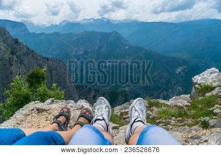 Loving Couple Resting On The Top Of The Mountain After Climbing