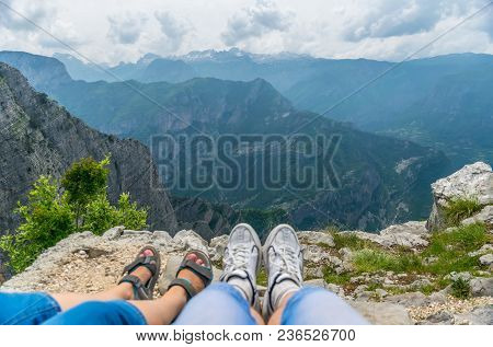 Loving Couple Resting On The Top Of The Mountain After Climbing