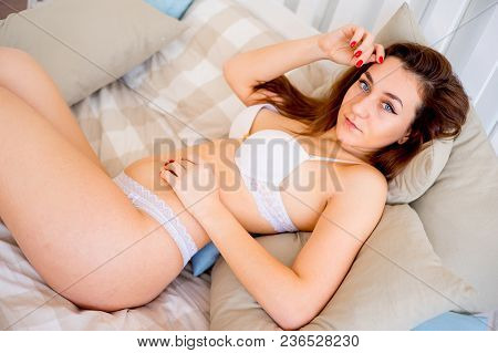 A Portrait Of A Beauriful Woman In A Lingerie