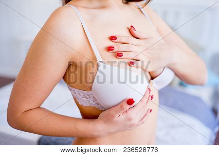 A Portrait Of A Woman Checking Her Breast