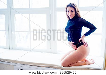 A Portrait Of A Beauriful Woman In A Lingerie