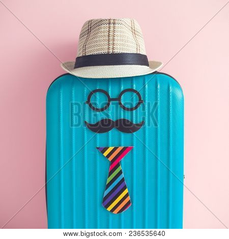 Suitcase And Paper Props In Form Of Globetrotter Hipster Person With Hat On Pastel Pink Background C