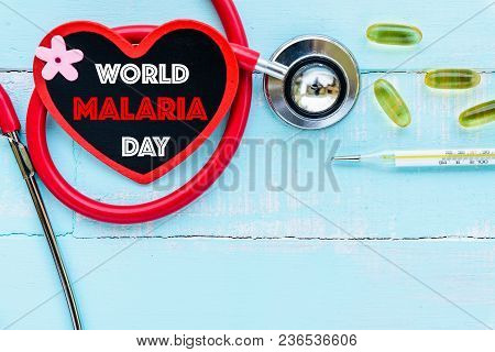 World Malaria Day April 25, Healthcare And Medical Concept. Stethoscope, Red And Black Heart, Thermo