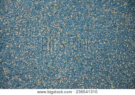 Texture Of A Colored Granular Sand Close Up. Blue Grains