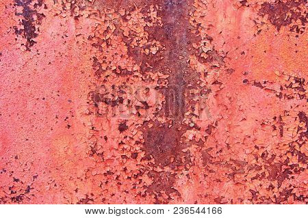 Old Rusty Metal Sheet Colored Red Paint Cracked. Abstract Background. Metallic Background.
