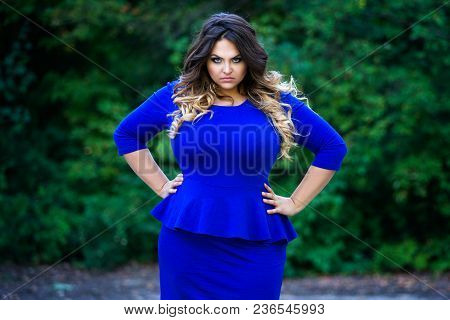 Angry Plus Size Fashion Model In Blue Dress Outdoors, Beauty Woman With Professional Makeup And Hair