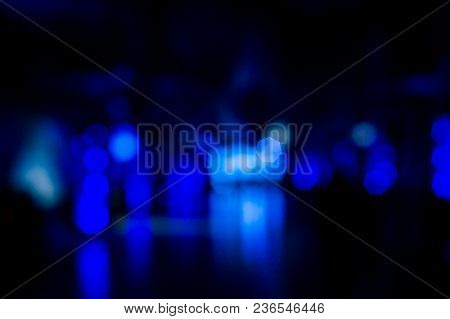 Blue Blisters On A Dark Background. Abstraction. Blue, Black. Blinked, Beacons Of Light In The Dark.