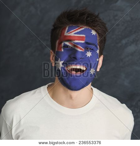 Portrait Of Happy Man With The Flag Of Australia Painted On His Face. Football Or Soccer Team Fan, S