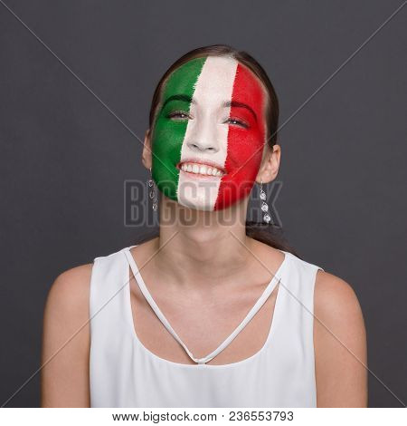 Portrait Of Happy Woman With The Flag Of Italy Painted On His Face. Football Or Soccer Team Fan, Spo
