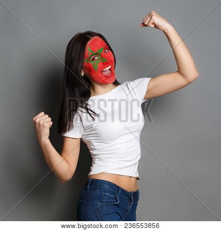 Portrait Of Happy Woman With The Flag Of Morocco Painted On His Face. Football Or Soccer Team Fan, S