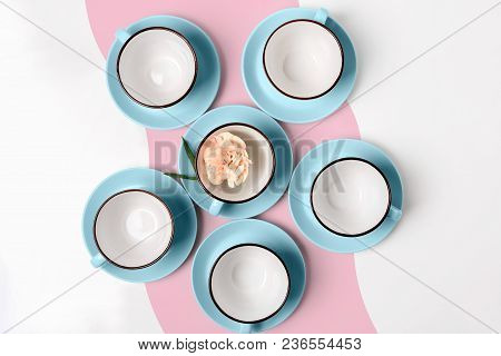 Clean Coffee Or Tea Set. Plenty Of Elegant Porcelain Light Blue Cups And Saucers At Funky Abstract P