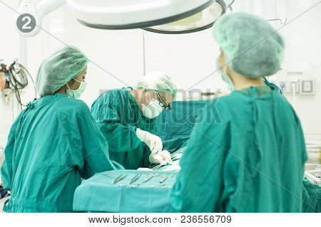 The Surgery Team Working Together At The Operating Room In The Hospital.