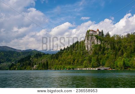 Scenic View Of Lake Bled - Popular Tourist Attraction In Julian Alps - With Castle On The Rock And M