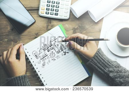 Woman  Written Sketching Good Ideas With Phone And Coffee On Table