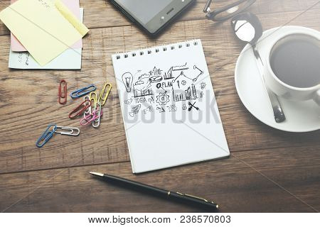 Sketching Good Ideas With Stationary And Coffee   On Wooden Table