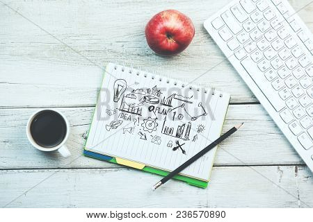 Sketching Good Ideas With Keyboard And Coffee   On Wooden Table