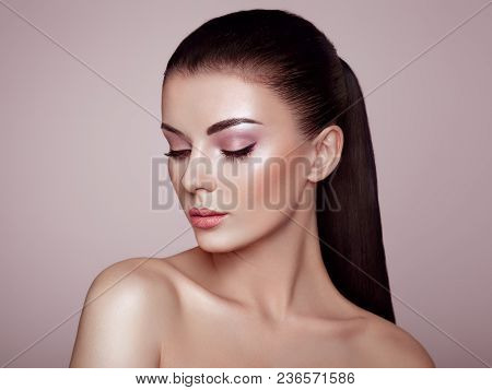 Beautiful Young Woman With Clean Fresh Skin. Perfect Makeup. Beauty Fashion. Eyelashes. Cosmetic Eye