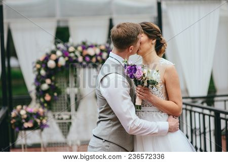 Bride And Groom Exchange Rings At The Wedding