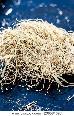 Ayurvedic Herb Vetiver Grass Or Khus On A Black Wooden Surface Used As A Flavoring Agent In Most Of