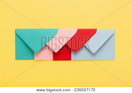 Abstract Background With Colofful Envelopes On Yellow Background. Minimal Styled, Postal Concept.
