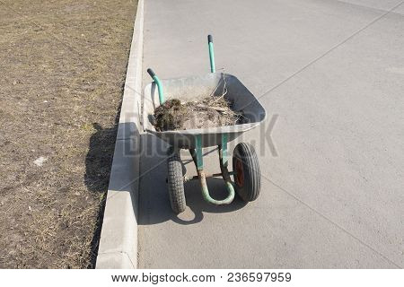 Wheelbarrow With Garbage, Cleaning Of The Territory