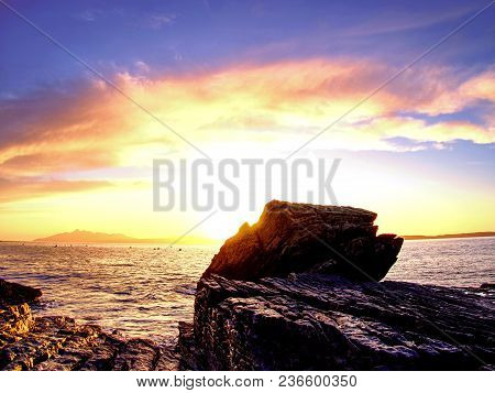 Rocks Near Elgol,  Loch Scavaig,  Isle Of Skye Scotland. Warm Sunset Colors In Cold February Evening