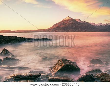 Evening At Loch Scavaig With Cuillins Mountains In Warm Sunset Light.  Isle Of Skye Scotland