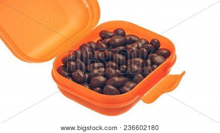 Candy, Chocolate-covered Raisins In The Orange Box On White Background