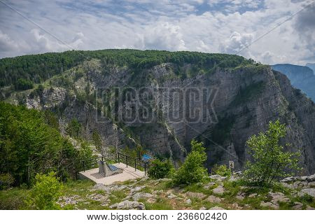 A Picturesque Bench For Meditation Is On Top Of A Cliff.