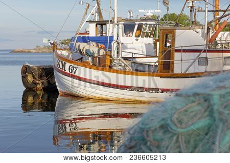 Grisslehamn, Sweden - Jul 08, 2017: Traditional Fishing Boats In The Small Harbor Early Morning. Gri