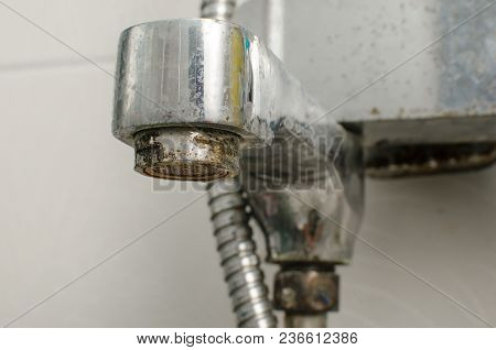 Hard Water Deposit And Rust On Shower Tap