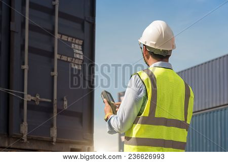 Truck With Cargo Container On Road In Shipping Yard Or Dock Yard Against Sunrise