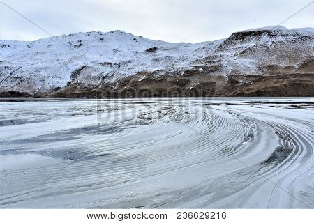 Snow Pushed To One Side Of Unalaska Lake, Alaska.