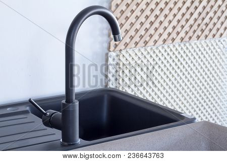 Modern Kitchen And Bathroom Water Faucets In The Store. Selective Focus. There Is Free Space For Tex
