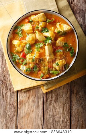 Bobo Chicken With Vegetables In Coconut Milk Close-up In A Bowl. Vertical Top View