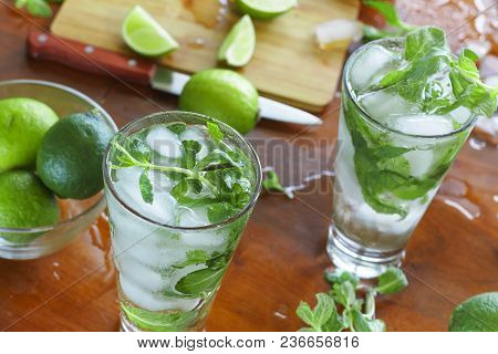 Process Of Preparing A Home Cocktail Mojito With Ice, Lime And Soda. Alcohol, Summer Time