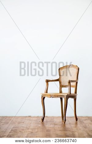 Old Chair On A Gray Wall Background