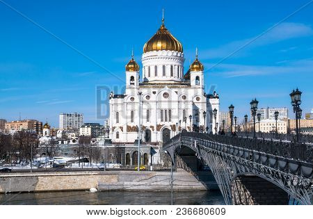 The New Building Of Russian Orthodox Cathedral Of Christ The Saviour And The Patriarchy Bridge Over 