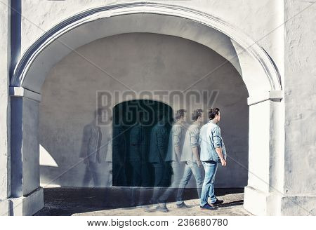 Narcissistic Handsome Young Man Admiring His Reflection In The Mirror In A Show Of Self-absorption