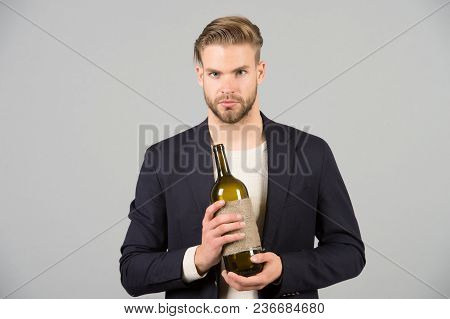 Boss With Bottle Of Wine In Hands. Bearded Man Hold Alcoholic Drink. Sommelier Or Degustator With Wi