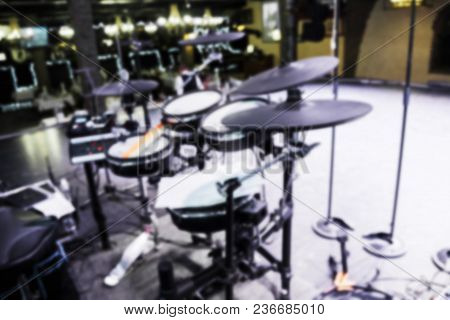Blurry Background Of Drummers Drum Set On Scene In Bright Lights. Professional Concert Audio Drummin